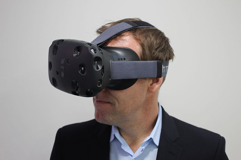 HTC executive director of marketing, Jeff Gattis wears the HTC Vive. Photo by: Maurizio Pesce / Wikimedia Commons