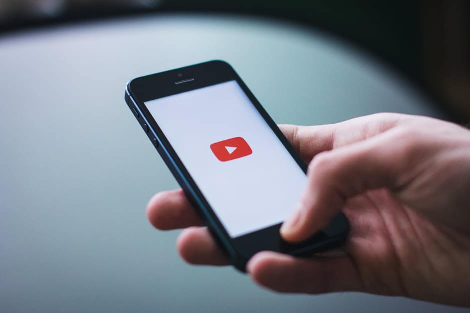 A smartphone user opening the YouTube application. Photo by: Pexels.com