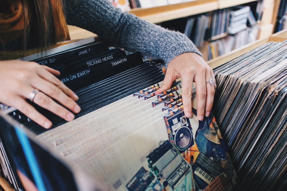 A shopper looks over vinyl records before Black Friday. Photo by: Pexels.com