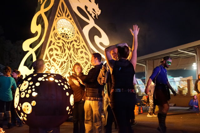 A gathering around wood burning installation. Photo taken at the 2017 Gem and Jam Festival. Photo by: Samantha Harvey A gathering around wood burning installation. Photo taken at the 2017 Gem and Jam Festival. Photo by: Samantha Harvey