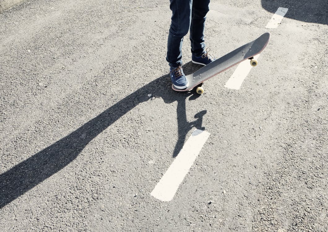 A skateboarder on the street. Photo by: Pexels.com