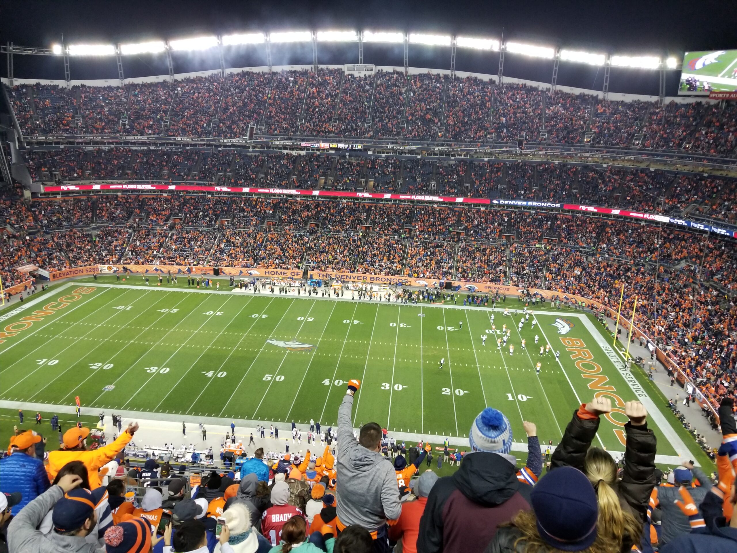 Guests cheer on the Denver Broncos at Mile High Stadium. Photo by: Matthew McGuire