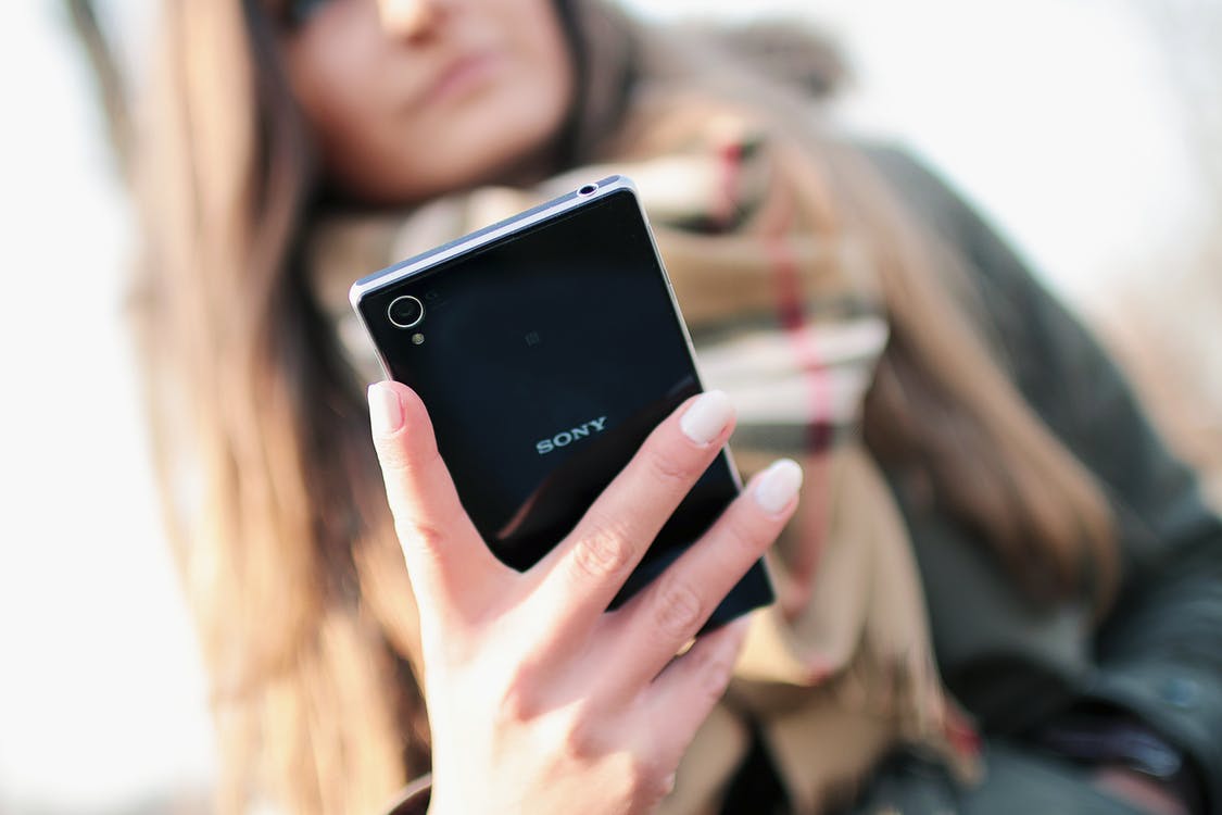 A person interacting with a Sony smartphone. Photo by: JÉSHOOTS / Pexels.com
