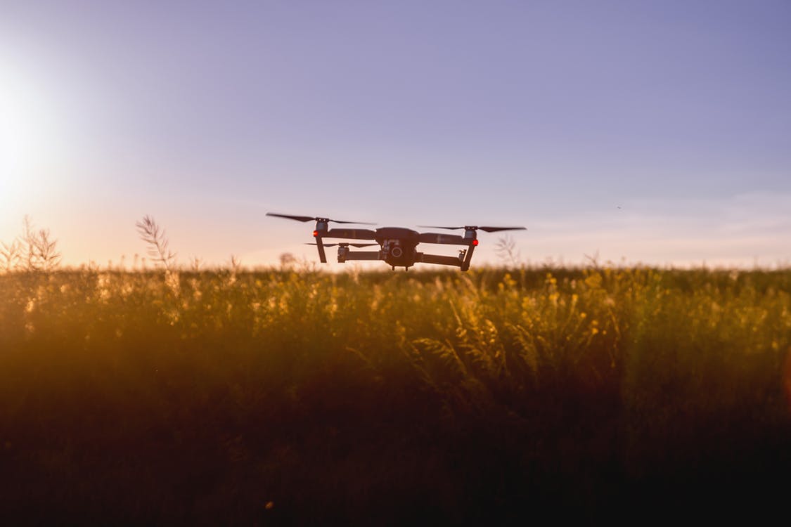 Drone flying over a field. Photo by: JESHOOTS.com / Pexels.com