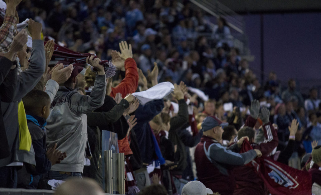 Colorado Rapids fans celebrate after the first goal of the game. Photo by: Matthew McGuire on 03/24/18 at Dick's Sporting Goods Park