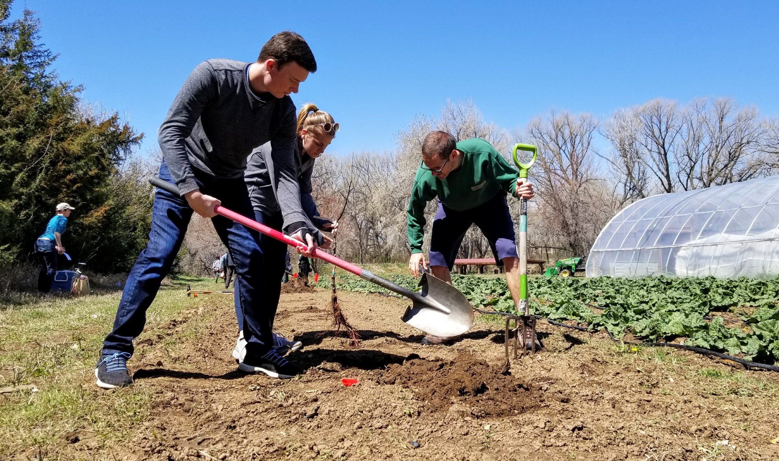 Residents around Longmont, Colorado help dig soil to plant new vegetation on Earth Day. Photo by: Matthew McGuire