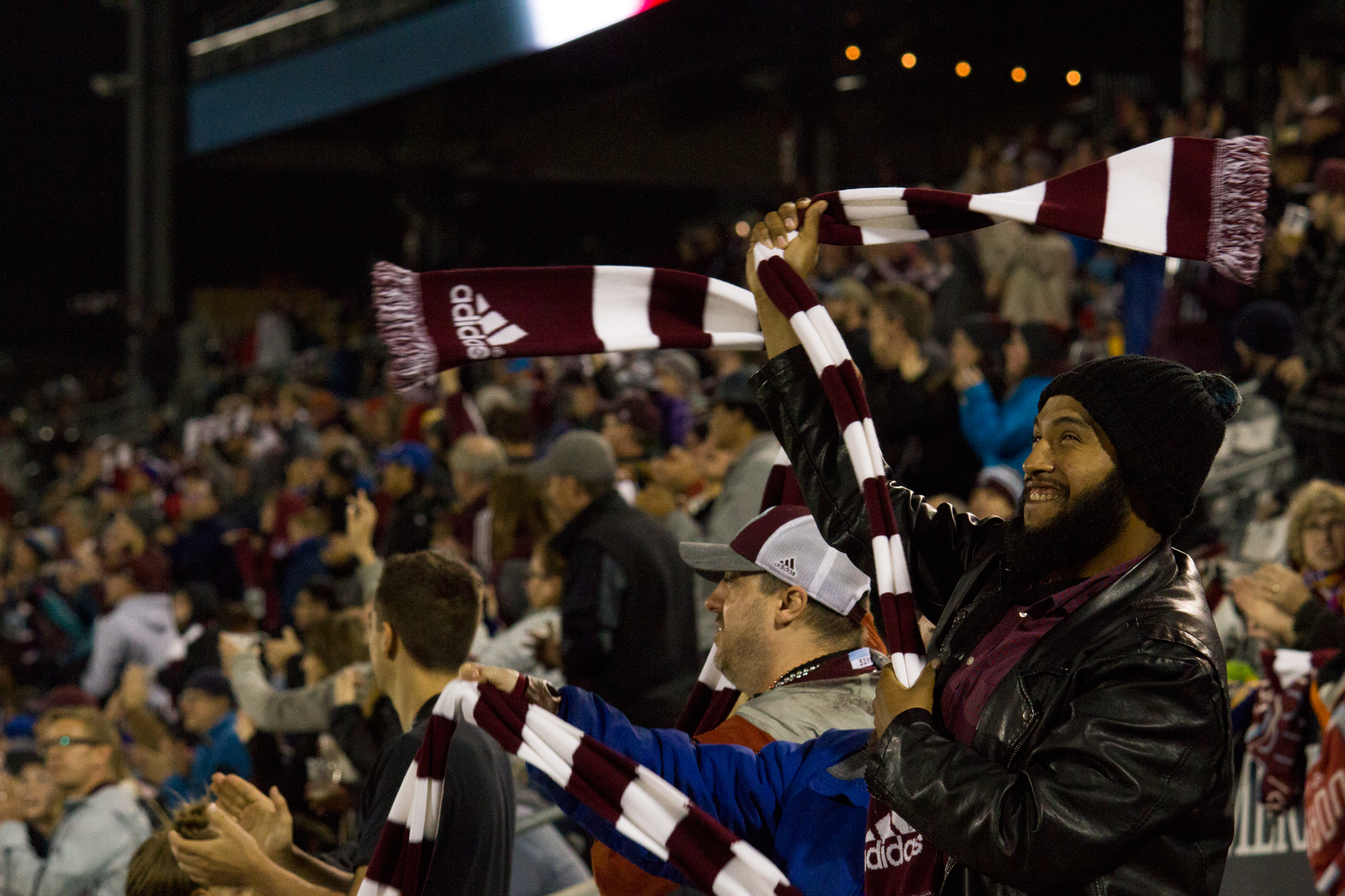 Attendees celebrate a goal in the second half at Dick's Sporting Goods Park. Photo by: Matthew McGuire