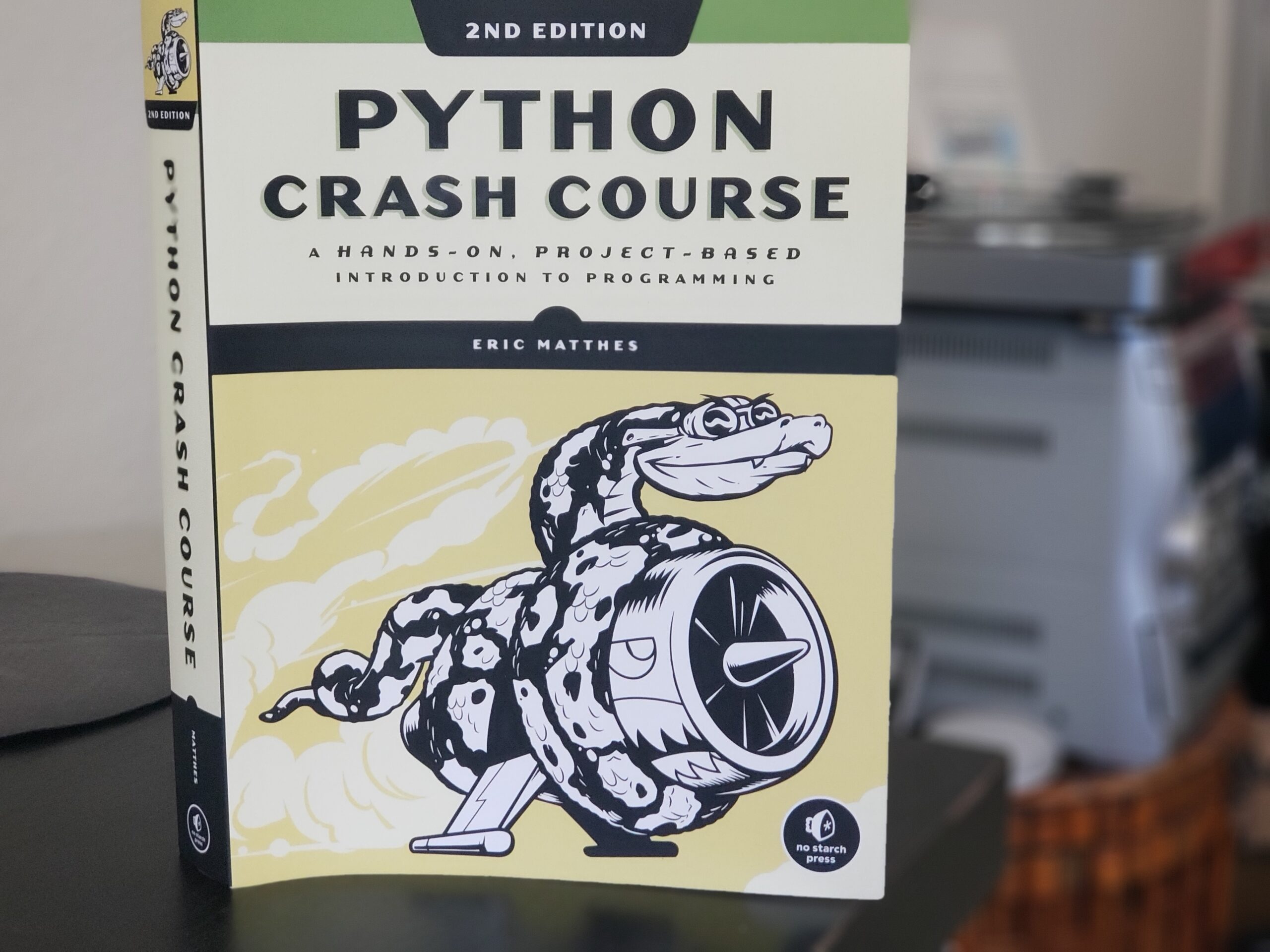 Python Crash Course book cover. Photo by: Matthew McGuire