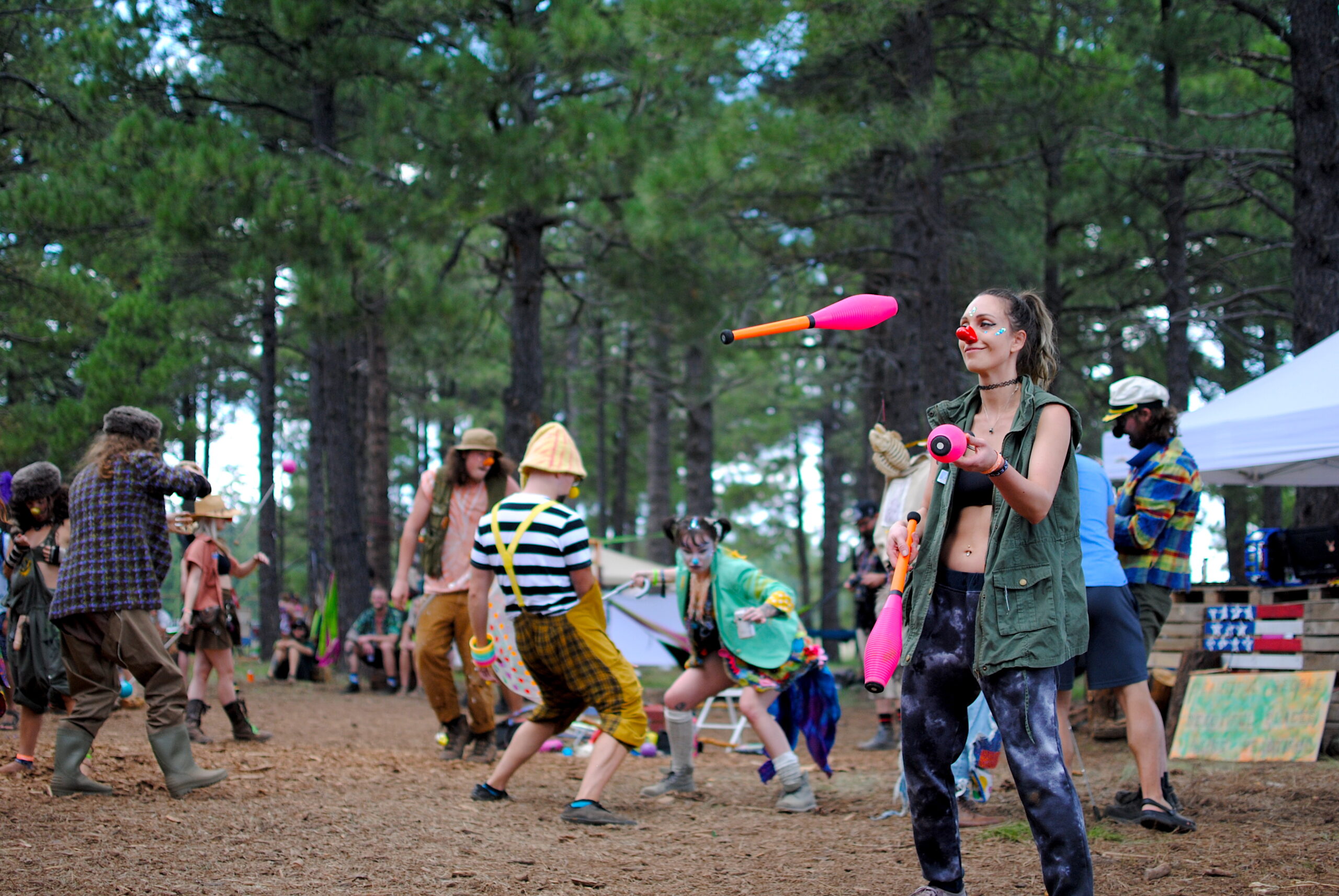 Festival-goers groove and flow among the Ponderosa Pines. Photo by: Marissa Novel.