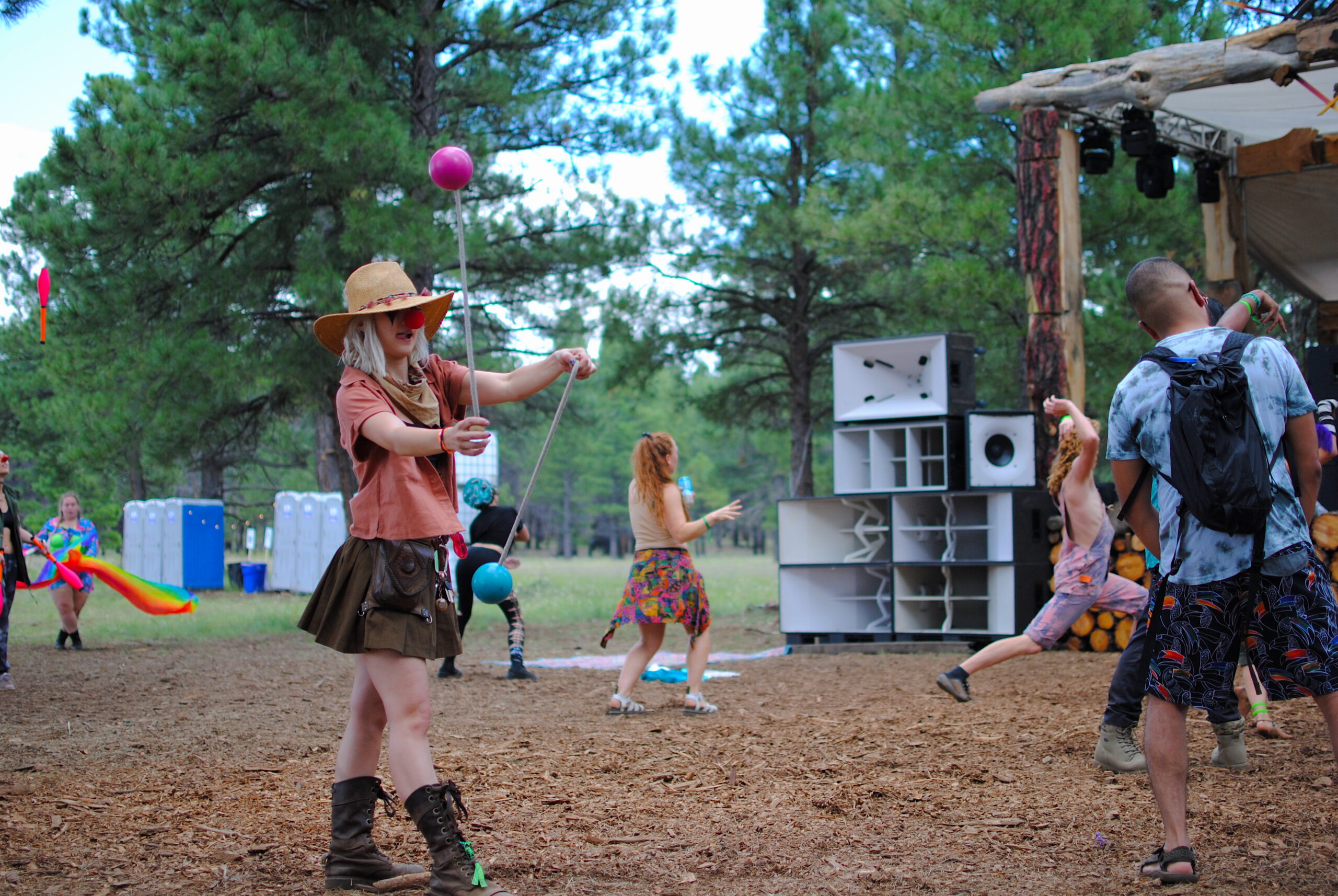 Festival-goers groove and flow among the Ponderosa Pines. Photo by: Marissa Novel.