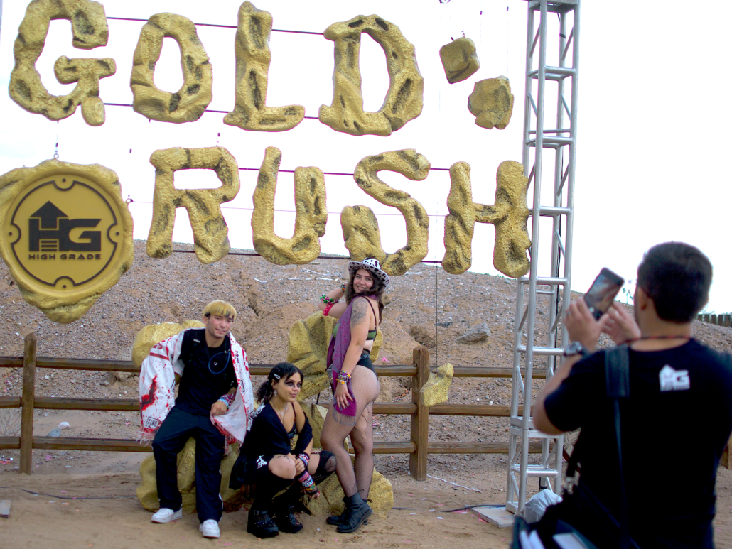 Festival attendees snap a picture with a Goldrush-themed backdrop. Photo by Marissa Novel.
